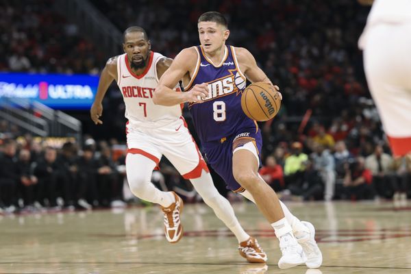 Dec 5, 2025; Houston, Texas, USA; Phoenix Suns guard Grayson Allen (8) dribbles the ball as Houston Rockets forward Kevin Durant (7) defends during the third quarter at Toyota Center. Mandatory Credit: Troy Taormina-Imagn Images