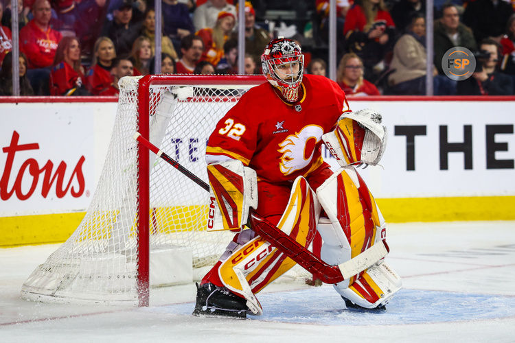 Feb 23, 2025; Calgary, Alberta, CAN; Calgary Flames goaltender Dustin Wolf (32) guards his net against the San Jose Sharks during the third period at Scotiabank Saddledome. Credit: Sergei Belski-Imagn Images