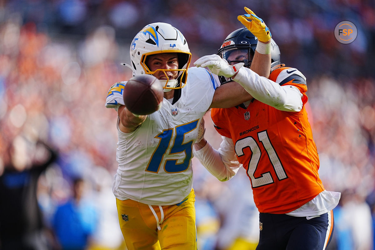 Oct 13, 2024; Denver, Colorado, USA; Denver Broncos cornerback Riley Moss (21) breaks up a pass to Los Angeles Chargers wide receiver Ladd McConkey (15) in the second half at Empower Field at Mile High. Credit: Ron Chenoy-Imagn Images