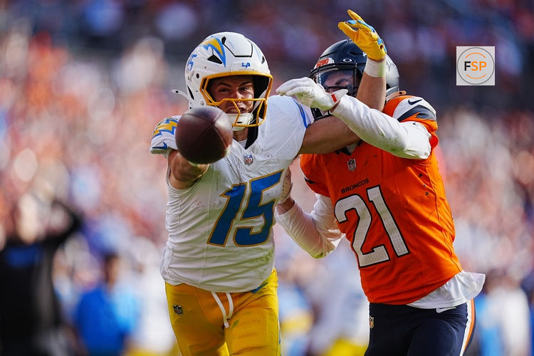 Oct 13, 2024; Denver, Colorado, USA; Denver Broncos cornerback Riley Moss (21) breaks up a pass to Los Angeles Chargers wide receiver Ladd McConkey (15) in the second half at Empower Field at Mile High. Credit: Ron Chenoy-Imagn Images