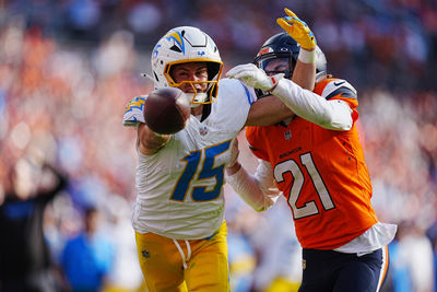 Oct 13, 2024; Denver, Colorado, USA; Denver Broncos cornerback Riley Moss (21) breaks up a pass to Los Angeles Chargers wide receiver Ladd McConkey (15) in the second half at Empower Field at Mile High. Mandatory Credit: Ron Chenoy-Imagn Images