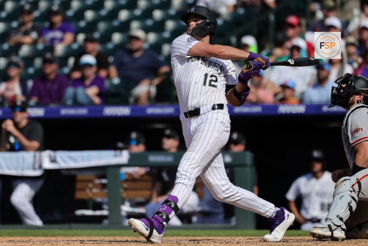 Jul 5, 2026; Denver, Colorado, USA; Colorado Rockies third baseman Kyle Karros (12) watches his ball on a three run home run in the eighth inning against the San Francisco Giants at Coors Field. Credit: Isaiah J. Downing-Imagn Images