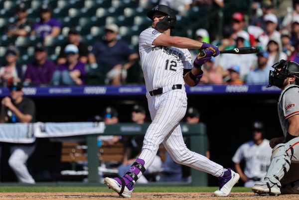 Jul 5, 2026; Denver, Colorado, USA; Colorado Rockies third baseman Kyle Karros (12) watches his ball on a three run home run in the eighth inning against the San Francisco Giants at Coors Field. Mandatory Credit: Isaiah J. Downing-Imagn Images