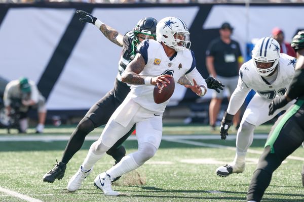 Oct 5, 2025; East Rutherford, New Jersey, USA; Dallas Cowboys quarterback Dak Prescott (4) scrambles as New York Jets defensive end Braiden McGregor (55) applies pressure during the second half at MetLife Stadium. Mandatory Credit: Vincent Carchietta-Imagn Images