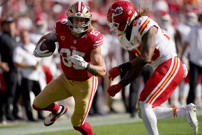 Oct 20, 2024; Santa Clara, California, USA; San Francisco 49ers tight end George Kittle (85) runs with the ball after making a catch next to Kansas City Chiefs safety Justin Reid (20) in the third quarter at Levi's Stadium. Mandatory Credit: Cary Edmondson-Imagn Images