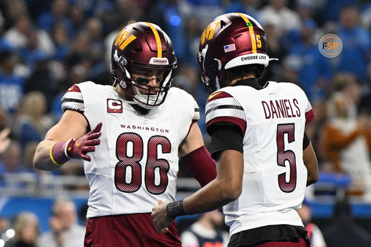 Jan 18, 2025; Detroit, Michigan, USA; Washington Commanders tight end Zach Ertz (86) celebrates touchdown pass with quarterback Jayden Daniels (5) during the second quarter in a 2025 NFC divisional round game at Ford Field. Credit: Lon Horwedel-Imagn Images