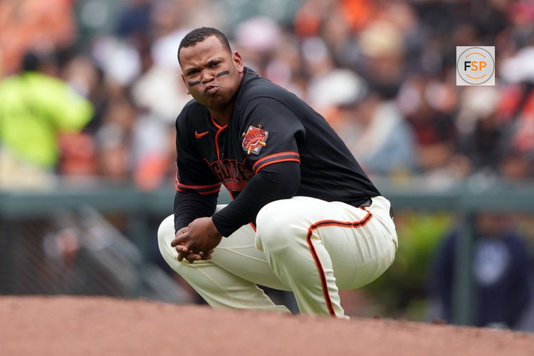 Apr 25, 2026; San Francisco, California, USA; San Francisco Giants first baseman Rafael Devers (16) kneels near first base after striking out against the Miami Marlins during the first inning at Oracle Park. Credit: Darren Yamashita-Imagn Images