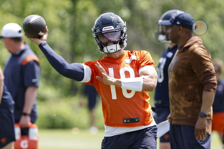 May 31, 2024; Lake Forest, IL, USA; Chicago Bears quarterback Caleb Williams (18) throws the ball during organized team activities at Halas Hall. Credit: Kamil Krzaczynski-USA TODAY Sports