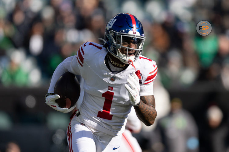 Jan 5, 2025; Philadelphia, Pennsylvania, USA; New York Giants wide receiver Malik Nabers (1) runs with the ball against the Philadelphia Eagles during the first quarter at Lincoln Financial Field. Credit: Bill Streicher-Imagn Images