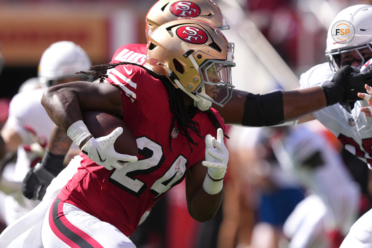 Oct 6, 2024; Santa Clara, California, USA; San Francisco 49ers running back Jordan Mason (24) carries the ball against the Arizona Cardinals during the second quarter at Levi's Stadium. Credit: Darren Yamashita-Imagn Images