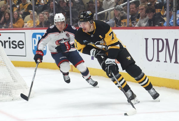 Mar 21, 2025; Pittsburgh, Pennsylvania, USA;  Pittsburgh Penguins center Evgeni Malkin (71) skates with the puck ahead of Columbus Blue Jackets defenseman Denton Mateychuk (5) during the first period at PPG Paints Arena. Mandatory Credit: Charles LeClaire-Imagn Images