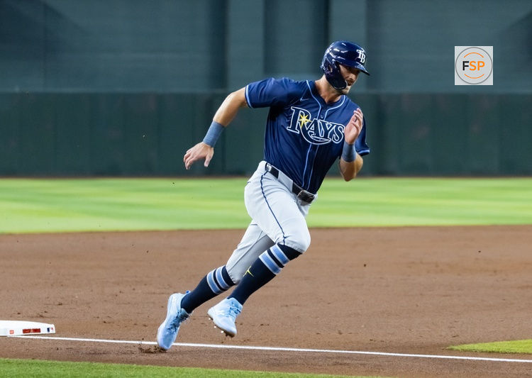 Apr 22, 2025; Phoenix, Arizona, USA; Tampa Bay Rays base runner Kameron Misner scores in the second inning against the Arizona Diamondbacks at Chase Field. Credit: Mark J. Rebilas-Imagn Images