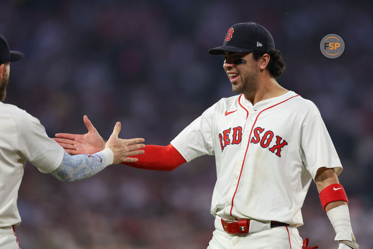 Jun 11, 2025; Boston, Massachusetts, USA; Boston Red Sox third baseman Marcelo Mayer (39) celebrates with Boston Red Sox shortstop Trevor Story (10) during the sixth inning against the Tampa Bay Rays at Fenway Park. Credit: Paul Rutherford-Imagn Images