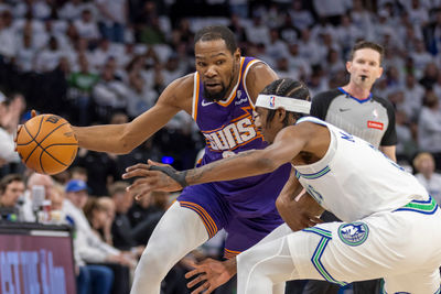 Apr 20, 2024; Minneapolis, Minnesota, USA; Phoenix Suns forward Kevin Durant (35) dribbles the ball around Minnesota Timberwolves forward Jaden McDaniels (3)] in the first half during game one of the first round for the 2024 NBA playoffs at Target Center. Mandatory Credit: Jesse Johnson-USA TODAY Sports