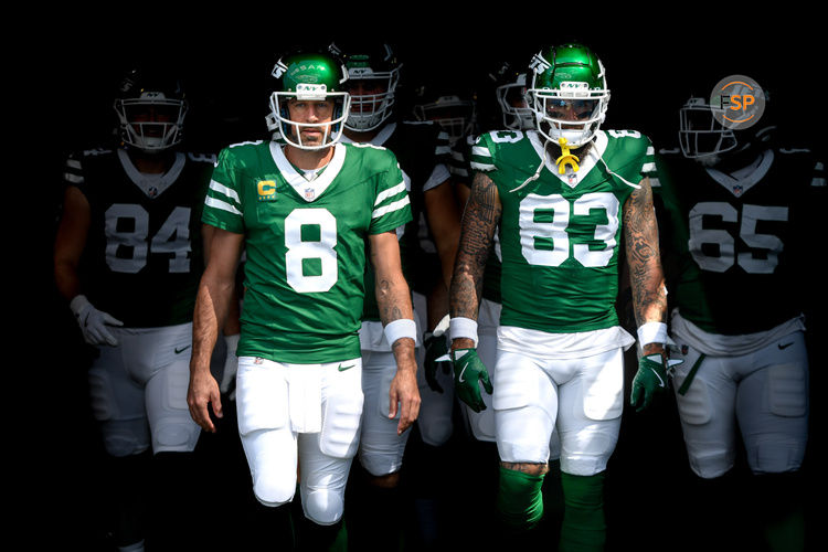 Sep 15, 2024; Nashville, Tennessee, USA;  New York Jets quarterback Aaron Rodgers (8) and tight end Tyler Conklin (83) takes the field against the Tennessee Titans during the first half at Nissan Stadium. Credit: Steve Roberts-Imagn Images