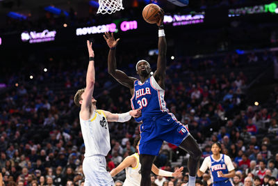 Mar 9, 2025; Philadelphia, Pennsylvania, USA; Philadelphia 76ers center Adem Bona (30) drives to shoot against Utah Jazz center Kyle Filipowski (22) in the second quarter at Wells Fargo Center. Mandatory Credit: Kyle Ross-Imagn Images