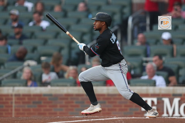 Aug 8, 2025; Cumberland, Georgia, USA; Miami Marlins shortstop Xavier Edwards (9) gets a base hit against the Atlanta Braves during the first inning at Truist Park. Credit: Mady Mertens-Imagn Images