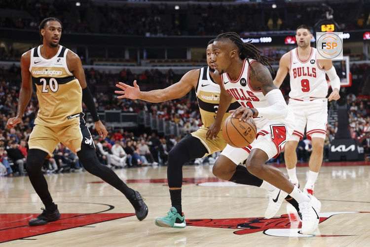 Nov 22, 2025; Chicago, Illinois, USA; Chicago Bulls guard Ayo Dosunmu (11) drives to the basket against the Washington Wizards during the first half at United Center. Credit: Kamil Krzaczynski-Imagn Images