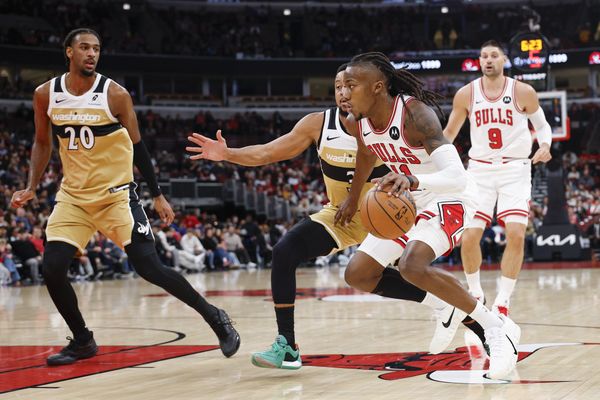 Nov 22, 2025; Chicago, Illinois, USA; Chicago Bulls guard Ayo Dosunmu (11) drives to the basket against the Washington Wizards during the first half at United Center. Mandatory Credit: Kamil Krzaczynski-Imagn Images