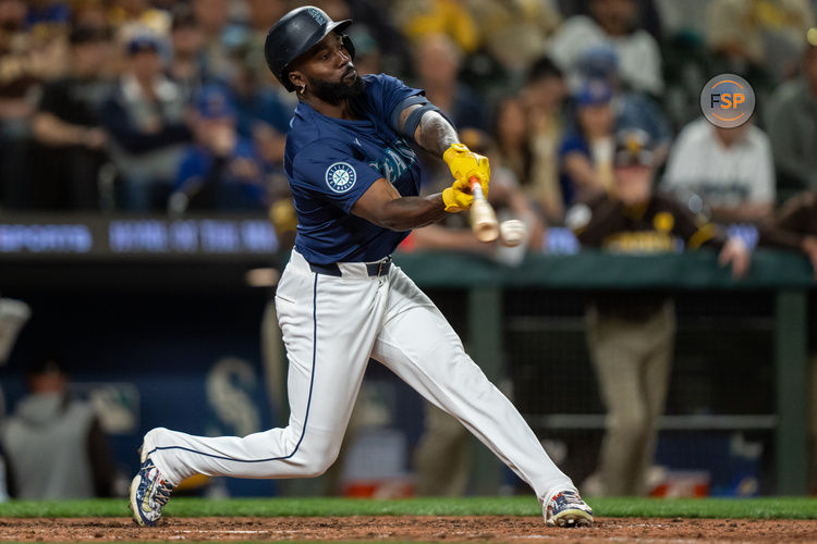 Sep 10, 2024; Seattle, Washington, USA;  Seattle Mariners left fielder Randy Arozarena (56) makes contact with a pitch during an at-bat against the San Diego Padres at T-Mobile Park. Credit: Stephen Brashear-Imagn Images