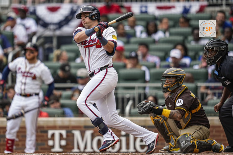 May 25, 2025; Cumberland, Georgia, USA; Atlanta Braves third baseman Austin Riley (27) hits a single against the San Diego Padres during the first inning at Truist Park. Credit: Dale Zanine-Imagn Images