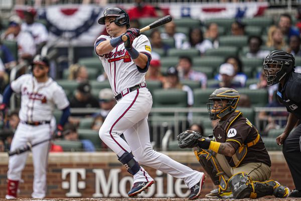 May 25, 2025; Cumberland, Georgia, USA; Atlanta Braves third baseman Austin Riley (27) hits a single against the San Diego Padres during the first inning at Truist Park. Mandatory Credit: Dale Zanine-Imagn Images