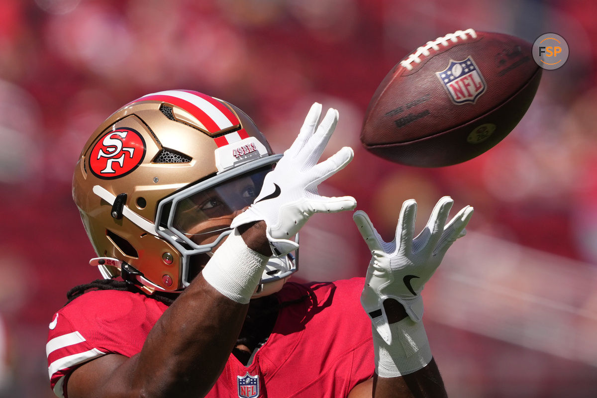 Oct 6, 2024; Santa Clara, California, USA; San Francisco 49ers running back Jordan Mason (24) warms up before the game against the Arizona Cardinals at Levi's Stadium. Credit: Darren Yamashita-Imagn Images