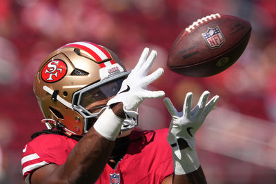 Oct 6, 2024; Santa Clara, California, USA; San Francisco 49ers running back Jordan Mason (24) warms up before the game against the Arizona Cardinals at Levi's Stadium. Mandatory Credit: Darren Yamashita-Imagn Images