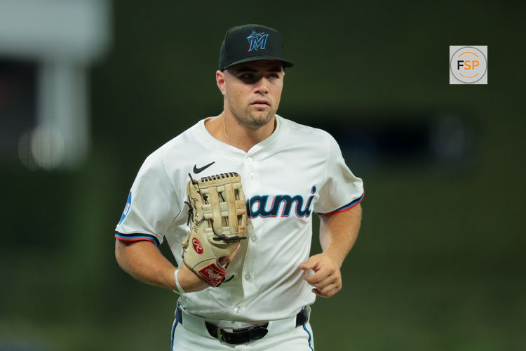 Aug 4, 2025; Miami, Florida, USA; Miami Marlins center fielder Jakob Marsee (87) returns to the dugout against the Houston Astros during the first inning at loanDepot Park. Credit: Sam Navarro-Imagn Images