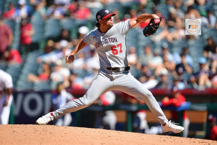Jun 29, 2025; Anaheim, California, USA; Washington Nationals pitcher Kyle Finnegan (67) throws against the Los Angeles Angels during the tenth inning at Angel Stadium. Credit: Gary A. Vasquez-Imagn Images