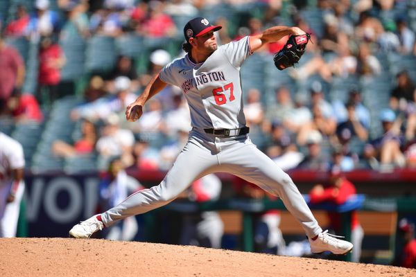 Jun 29, 2025; Anaheim, California, USA; Washington Nationals pitcher Kyle Finnegan (67) throws against the Los Angeles Angels during the tenth inning at Angel Stadium. Mandatory Credit: Gary A. Vasquez-Imagn Images