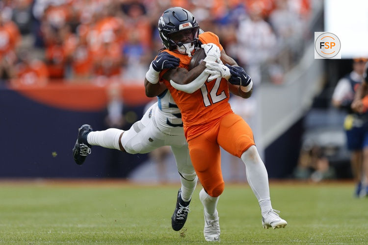 Sep 7, 2025; Denver, Colorado, USA; Denver Broncos running back RJ Harvey (12) rushes the ball against the Tennessee Titans in the second half at Empower Field at Mile High. Credit: Isaiah J. Downing-Imagn Images