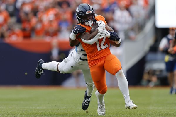 Sep 7, 2025; Denver, Colorado, USA; Denver Broncos running back RJ Harvey (12) rushes the ball against the Tennessee Titans in the second half at Empower Field at Mile High. Mandatory Credit: Isaiah J. Downing-Imagn Images