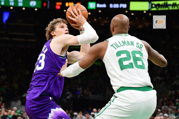 Nov 3, 2025; Boston, Massachusetts, USA; Utah Jazz forward Lauri Markkanen (23) controls the ball while Boston Celtics forward Xavier Tillman (26) defends during the second half at TD Garden. Credit: Bob DeChiara-Imagn Images