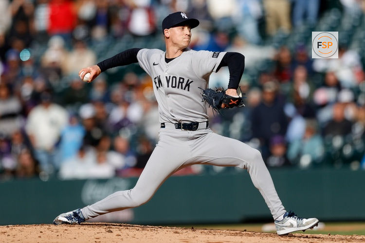 May 25, 2025; Denver, Colorado, USA; New York Yankees relief pitcher Luke Weaver (30) pitches in the ninth inning against the Colorado Rockies at Coors Field. Credit: Isaiah J. Downing-Imagn Images