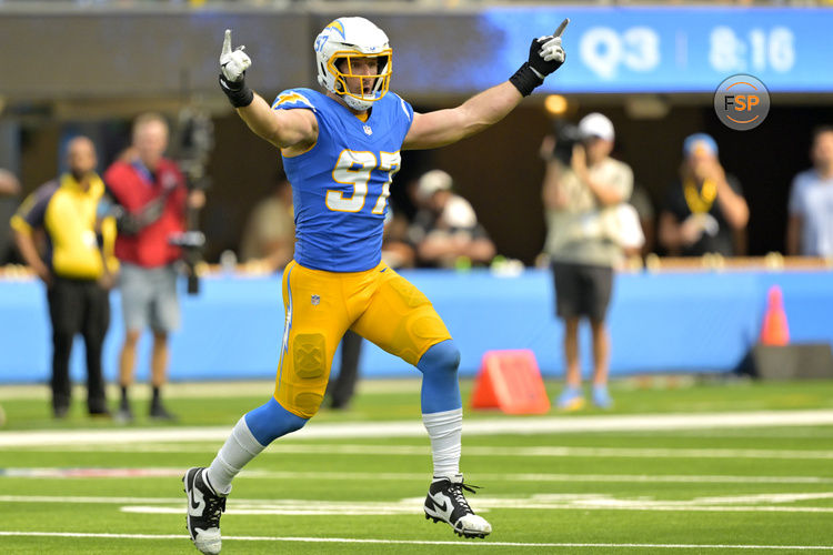 Sep 8, 2024; Inglewood, California, USA;  Los Angeles Chargers linebacker Joey Bosa (97) celebrates after forcing a fumble in the second half against the Las Vegas Raiders at SoFi Stadium. Credit: Jayne Kamin-Oncea-Imagn Images