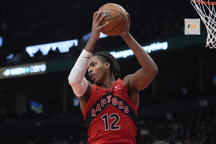 Oct 29, 2025; Toronto, Ontario, CAN; Toronto Raptors forward Collin Murray-Boyles (12) comes down with a rebound against the Houston Rockets during the second half at Scotiabank Arena. Credit: John E. Sokolowski-Imagn Images