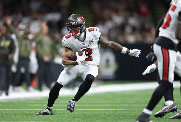 Oct 26, 2025; New Orleans, Louisiana, USA; Tampa Bay Buccaneers wide receiver Emeka Egbuka (2) runs for a gain during the first quarter against the New Orleans Saints at Caesars Superdome. Mandatory Credit: Stephen Lew-Imagn Images