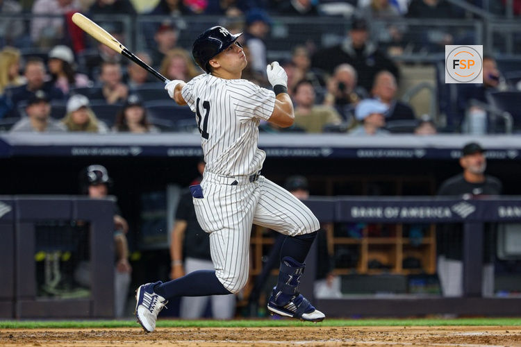Apr 3, 2025; Bronx, New York, USA; New York Yankees shortstop Anthony Volpe (11) singles while using a torpedo bat during the third inning against the Arizona Diamondbacks at Yankee Stadium. Credit: Vincent Carchietta-Imagn Images