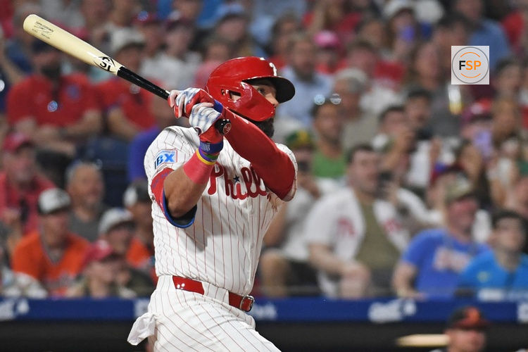 Aug 4, 2025; Philadelphia, Pennsylvania, USA; Philadelphia Phillies outfielder Kyle Schwarber (12) watches his grand slam home run during the sixth inning against the Baltimore Orioles at Citizens Bank Park. Credit: Eric Hartline-Imagn Images