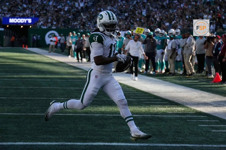 Oct 25, 2026; East Rutherford, New Jersey, USA;  New York Jets wide receiver Omar Cooper Jr. (11) scores a touchdown during the second half against the Miami Dolphins at MetLife Stadium.  Credit: Robert Deutsch-Imagn Images