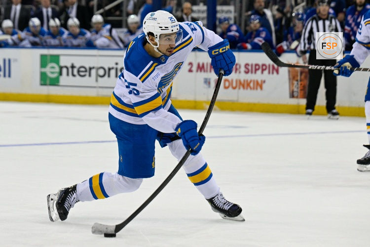 Nov 24, 2025; New York, New York, USA; St. Louis Blues right wing Jordan Kyrou (25) attempts a shot against the New York Rangers during the third period at Madison Square Garden. Credit: Dennis Schneidler-Imagn Images