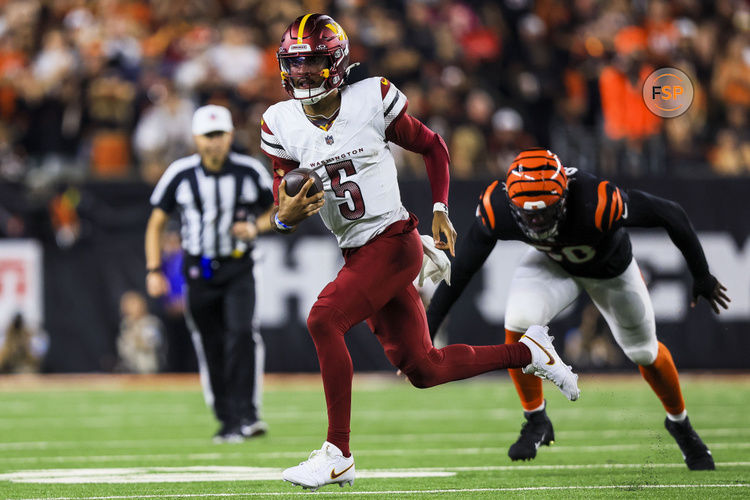 Sep 23, 2024; Cincinnati, Ohio, USA; Washington Commanders quarterback Jayden Daniels (5) runs with the ball against the Cincinnati Bengals in the second half at Paycor Stadium. Credit: Katie Stratman-Imagn Images