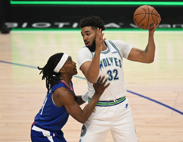 LOS ANGELES, CA - FEBRUARY 12: Los Angeles Clippers Guard Terance Mann (14) guards Minnesota Timberwolves Forward Karl-Anthony Towns (32) during a NBA basketball game on February 12, 2024. at the Crypto.com Arena in Los Angeles, CA.(Photo by John McCoy/Icon Sportswire)