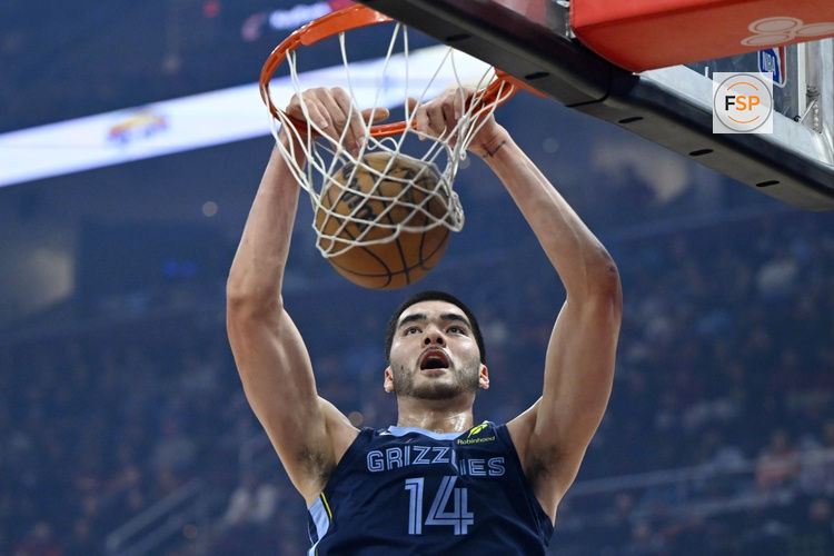 Nov 15, 2025; Cleveland, Ohio, USA; Memphis Grizzlies center Zach Edey (14) dunks in the first quarter against the Cleveland Cavaliers at Rocket Arena. Credit: David Richard-Imagn Images
