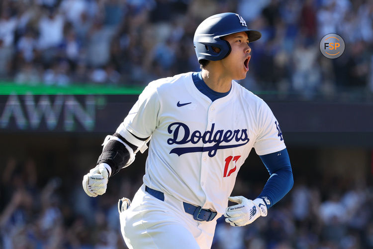 Sep 22, 2024; Los Angeles, California, USA;  Los Angeles Dodgers designated hitter Shohei Ohtani (17) celebrates on a game tying solo home run during the ninth inning against the Colorado Rockies at Dodger Stadium. Credit: Kiyoshi Mio-Imagn Images