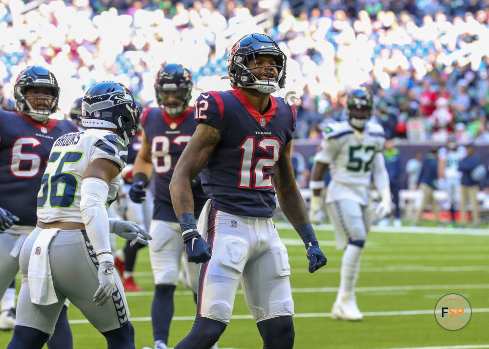 HOUSTON, TX - DECEMBER 12:  Houston Texans wide receiver Nico Collins (12) reacts after successfully carry the ball during the NFL football game between the Seattle Seahawks and Houston Texans on December 12, 2021 at NRG Stadium in Houston, Texas.  (Photo by Leslie Plaza Johnson/Icon Sportswire)