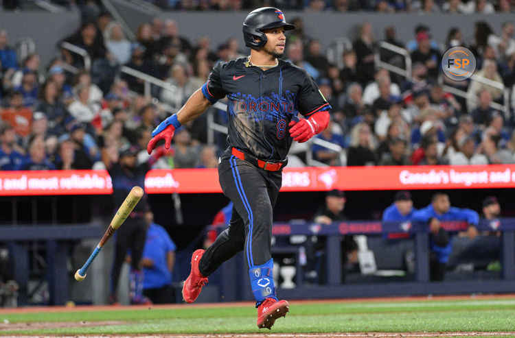 Sep 25, 2024; Toronto, Ontario, CAN;  Toronto Blue Jays center fielder Jonatan Clase (8) hits a two-run home run against the Boston Red Sox in the seventh inning at Rogers Centre. Credit: Dan Hamilton-Imagn Images