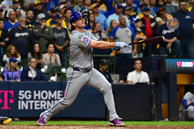 Oct 3, 2024; Milwaukee, Wisconsin, USA; New York Mets first baseman Pete Alonso (20) hits a three run home run against the Milwaukee Brewers in the ninth inning during game three of the Wildcard round for the 2024 MLB Playoffs at American Family Field. Credit: Benny Sieu-Imagn Images