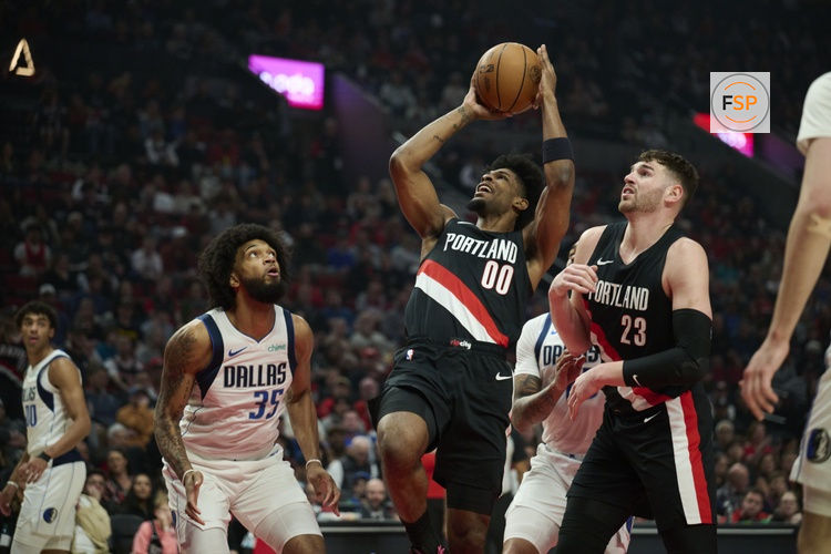 Mar 27, 2026; Portland, Oregon, USA;  Portland Trail Blazers guard Scoot Henderson (00) shoots a basket during the first half against Dallas Mavericks forward Marvin Bagley III (35) at Moda Center. Credit: Troy Wayrynen-Imagn Images